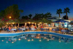Enjoy your meals under the stars around the pool and close to the beach